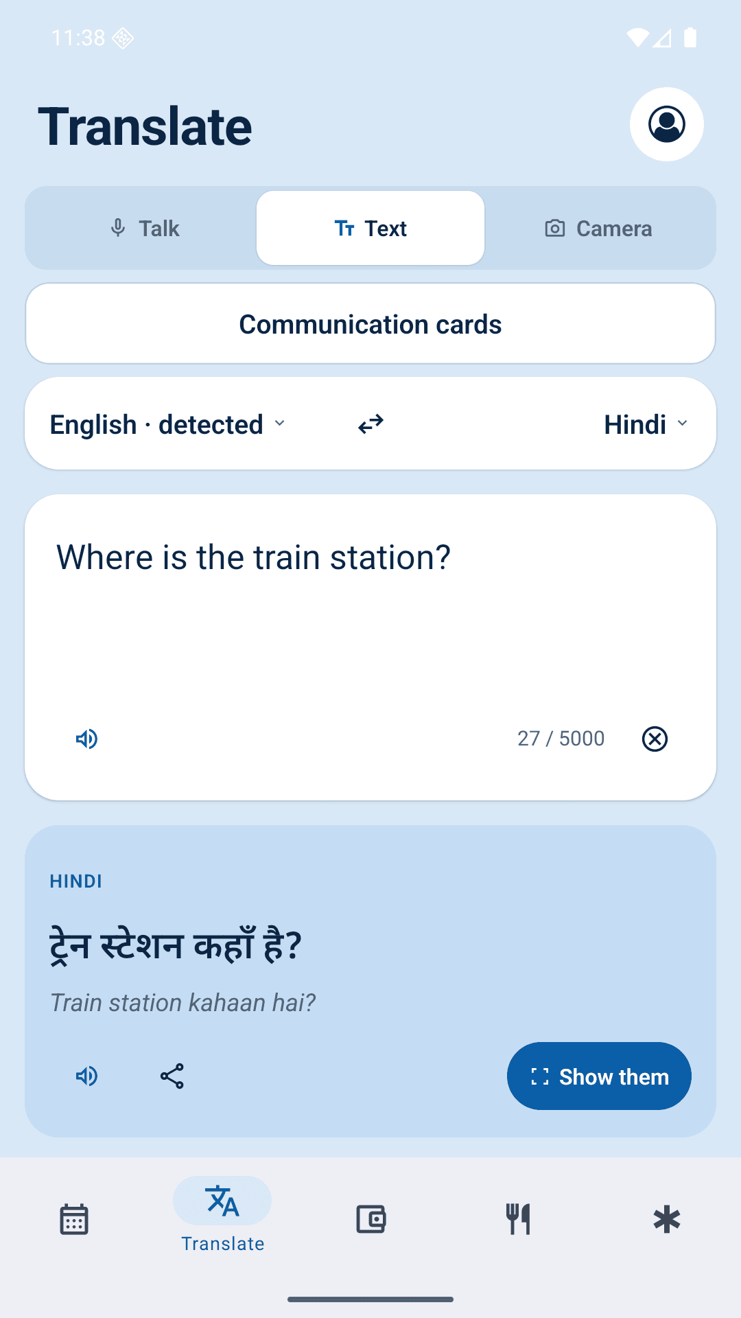 Roamie translating “Where is the train station?” into Hindi, with a Show them button to display the translation